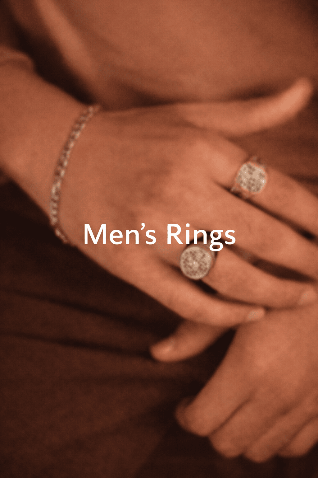 Men’s rings collection featuring stylish rings on hand with warm aesthetic