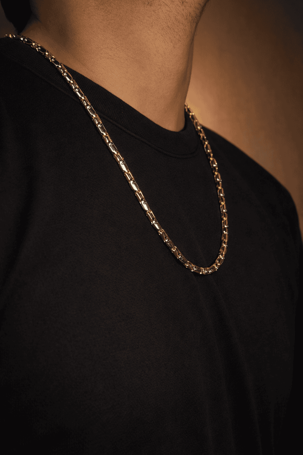 Gold and silver stainless steel biker link chain necklace for men in Pakistan, bold two tone heavy chain worn with black shirt, premium masculine jewelry
