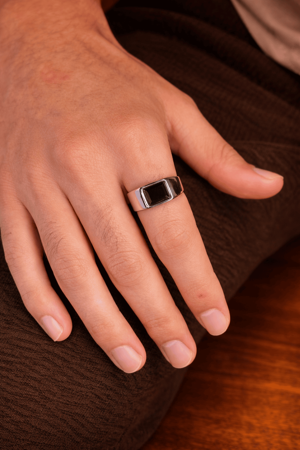 Men’s black agate signet ring worn on hand, stainless steel silver ring for men in Pakistan, modern square black stone ring for everyday style