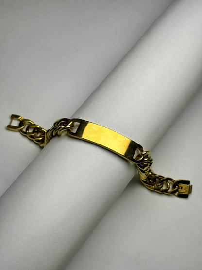 Engraved gold Cuban link bracelet with name plate, stainless steel men’s bracelet product display close-up