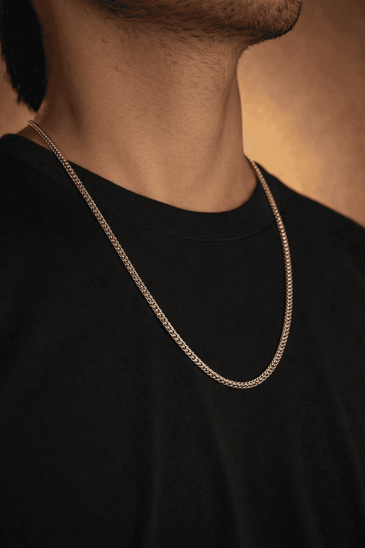 Men stainless steel foxtail chain necklace in Pakistan, polished silver foxtail link chain worn with black shirt, durable waterproof everyday men jewelry