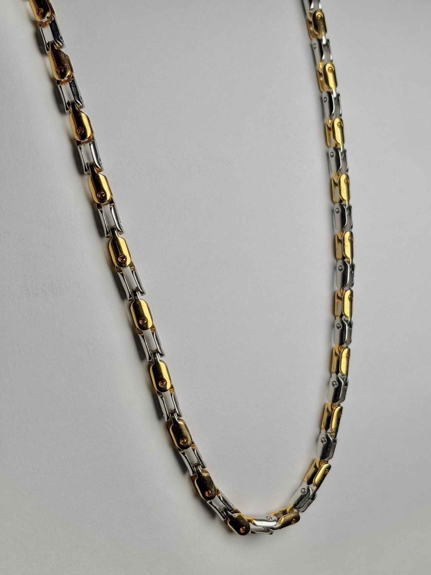 Two tone stainless steel biker link chain for men Pakistan, gold and silver polished heavy chain necklace close up detail, waterproof non tarnish metal