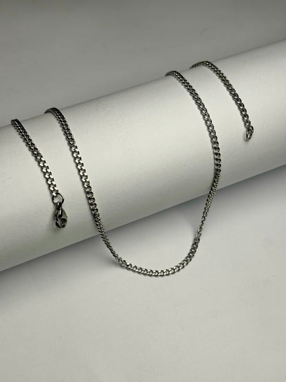 Stainless steel curb chain necklace for men Pakistan, polished silver flat curb link chain with lobster clasp on white background