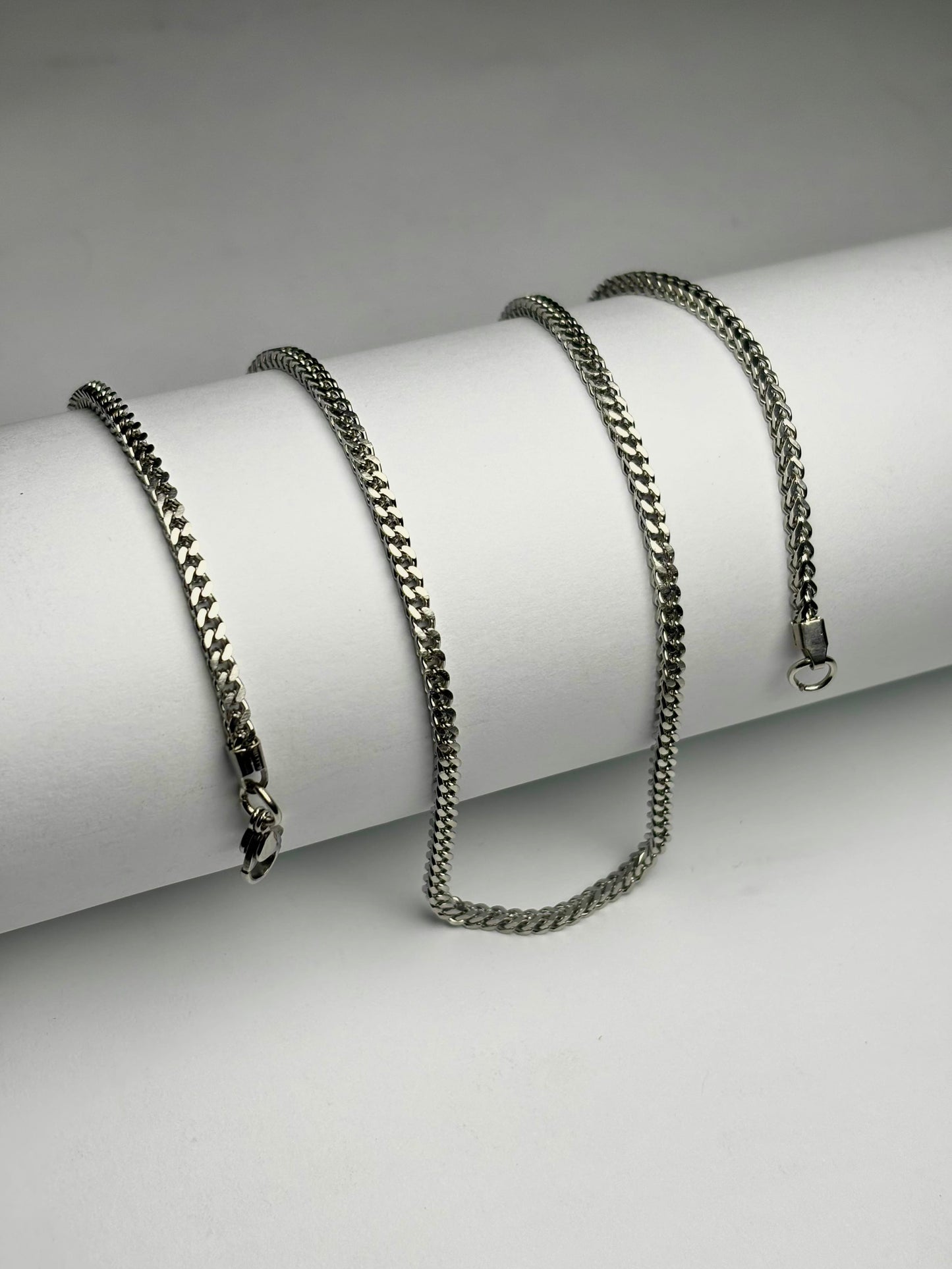 Stainless steel foxtail chain necklace for men Pakistan, polished silver foxtail link chain with lobster clasp on white background