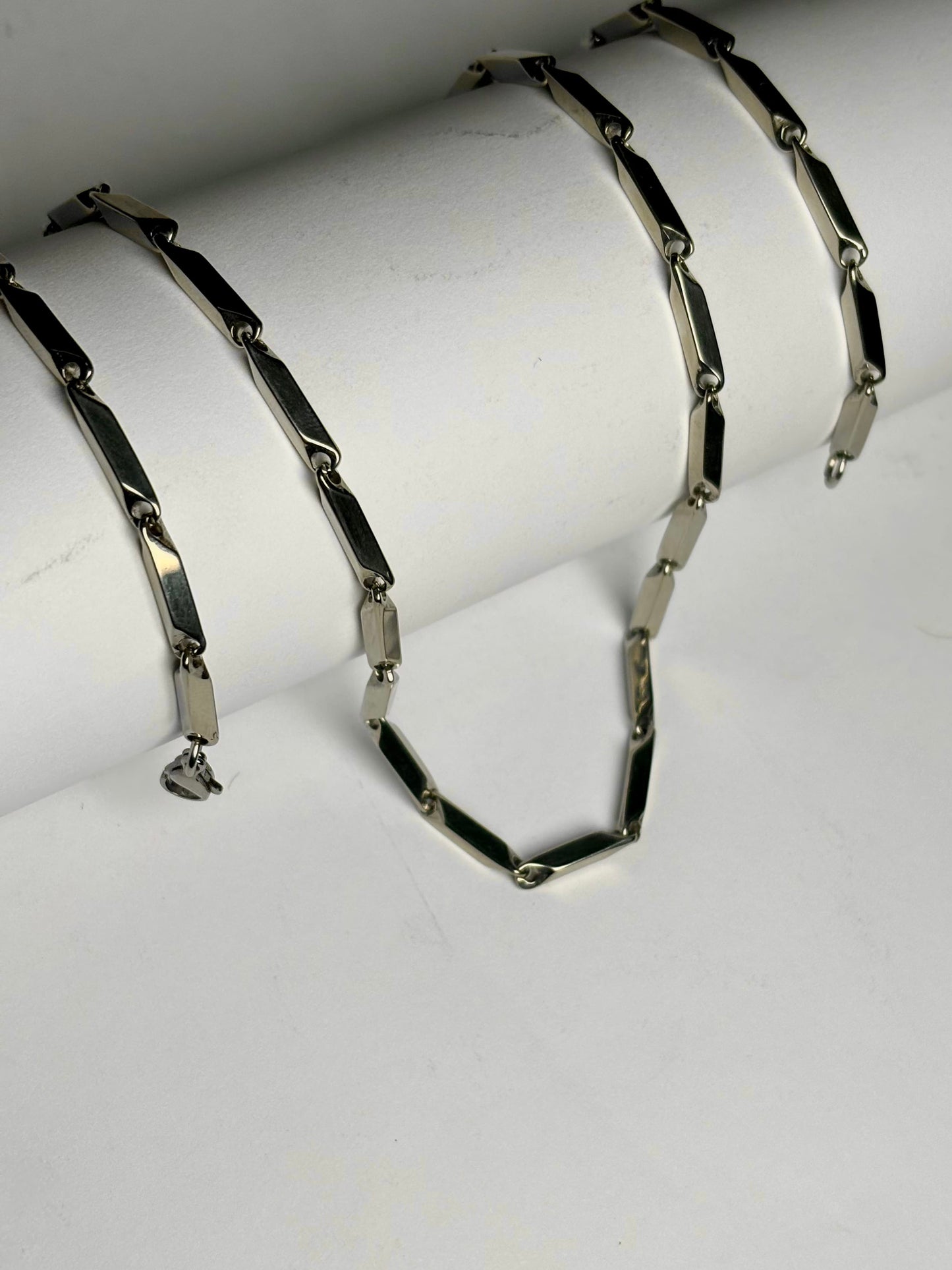 Silver stainless steel geometric link chain necklace for men Pakistan, modern bar link chain with secure lobster clasp on white background