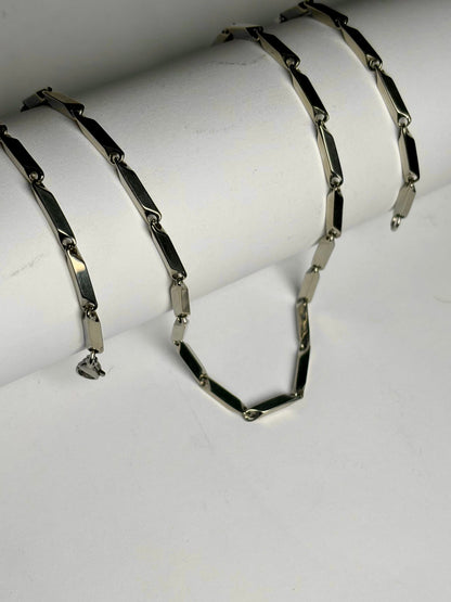 Silver stainless steel geometric link chain necklace for men Pakistan, modern bar link chain with secure lobster clasp on white background