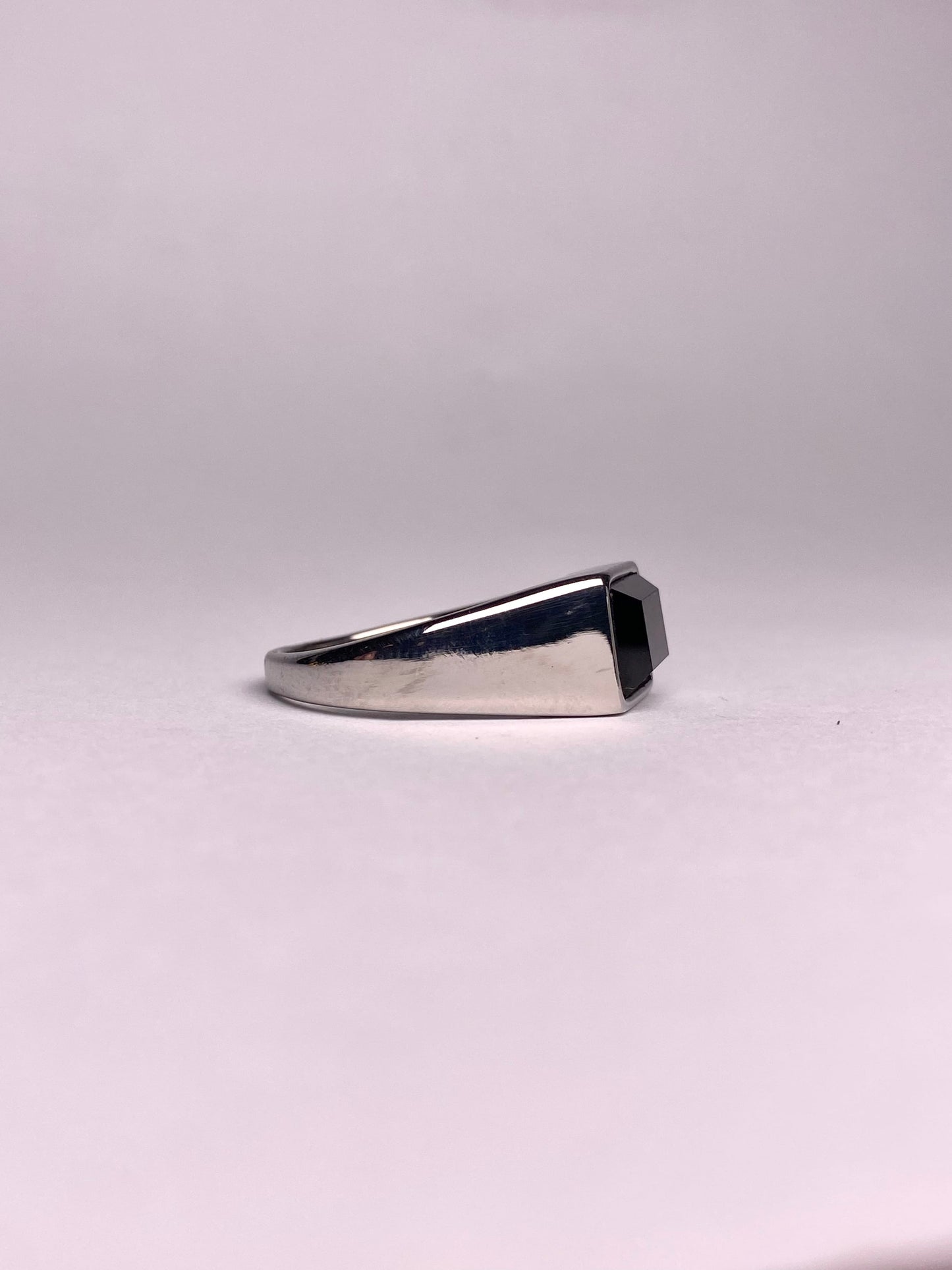 Side view of men’s black stone signet ring, sleek stainless steel silver ring with square black gemstone, premium ring available in Pakistan
