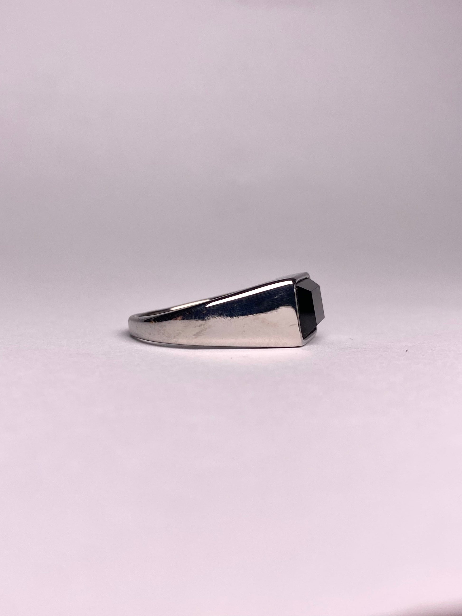 Side view of men’s black stone signet ring, sleek stainless steel silver ring with square black gemstone, premium ring available in Pakistan
