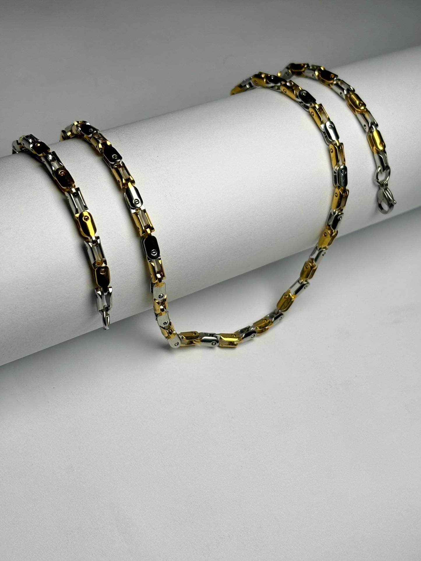 Gold and silver stainless steel biker link chain necklace for men in Pakistan, bold two tone heavy chain worn with black shirt, premium masculine jewelry