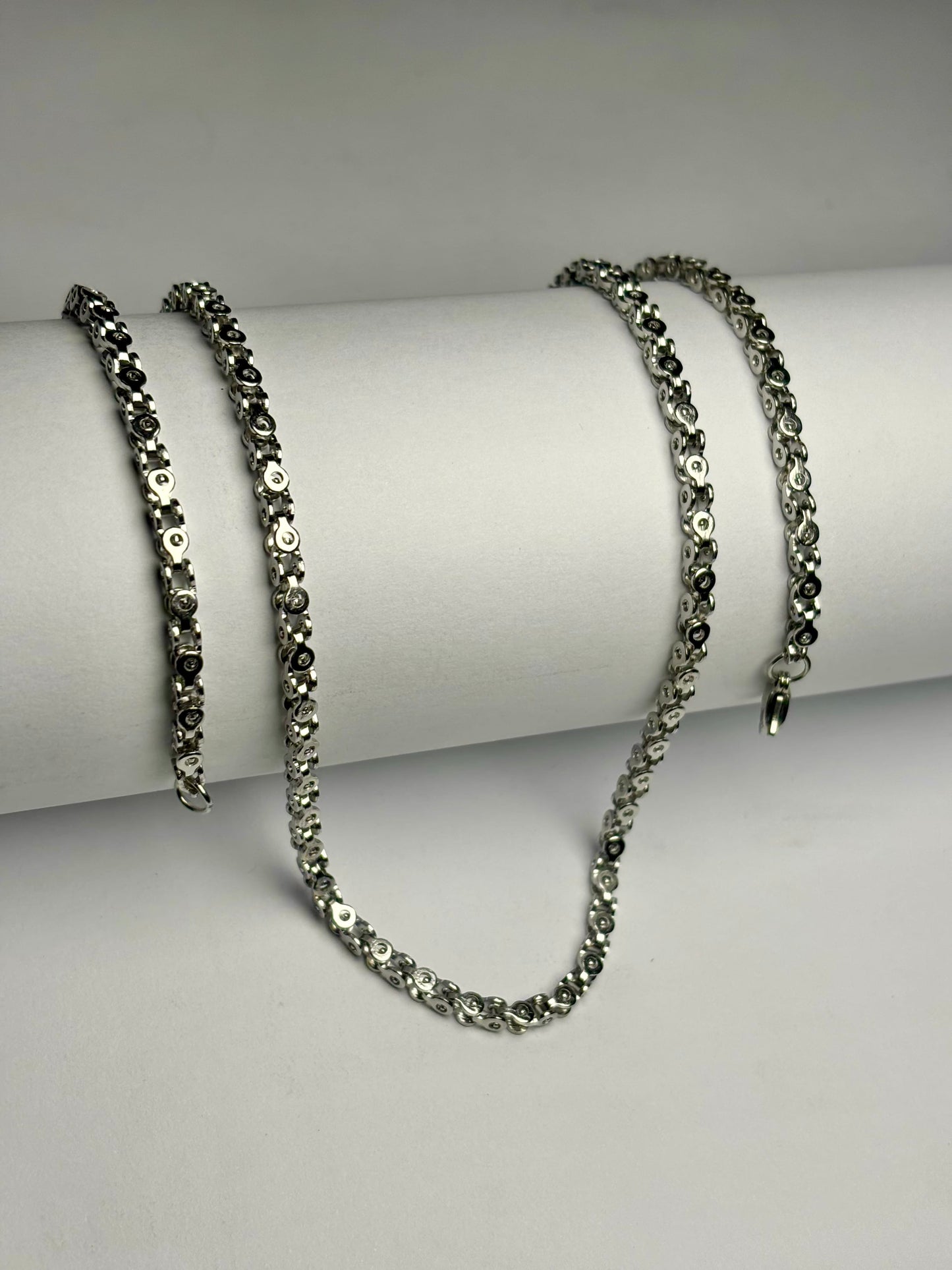 Silver stainless steel Byzantine chain necklace for men in Pakistan, polished intricate link chain with secure clasp close up detail, durable non tarnish metal jewelry