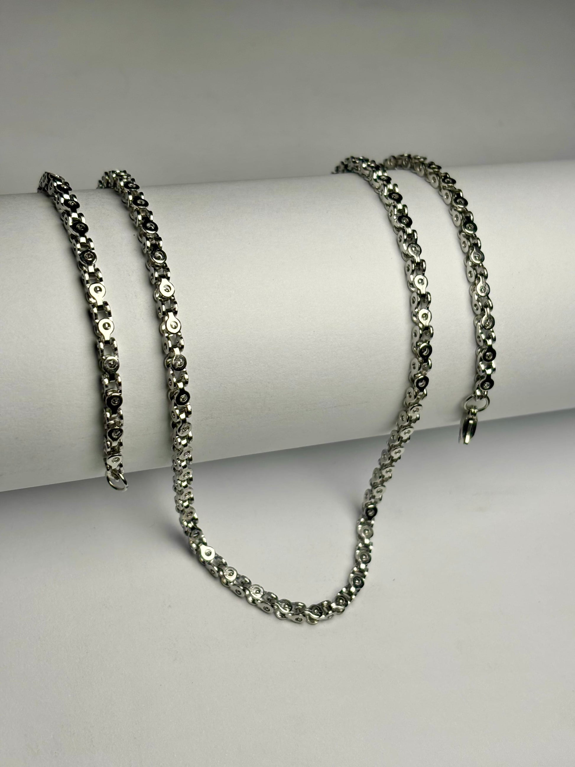 Silver stainless steel Byzantine chain necklace for men in Pakistan, polished intricate link chain with secure clasp close up detail, durable non tarnish metal jewelry