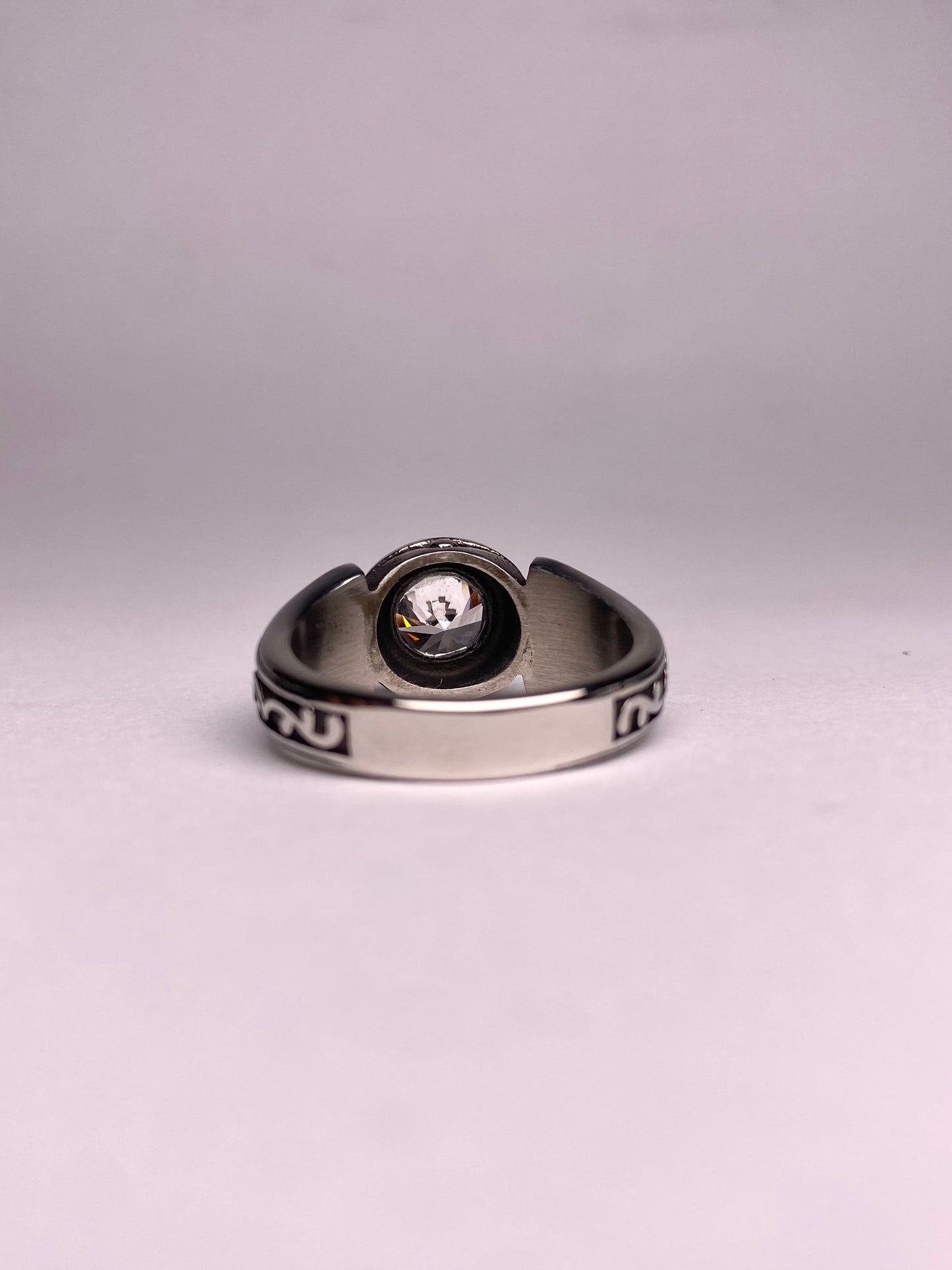 back view of minimal diamond ring for men, polished stainless steel ring with clear round stone, modern and stylish ring available in Pakistan
