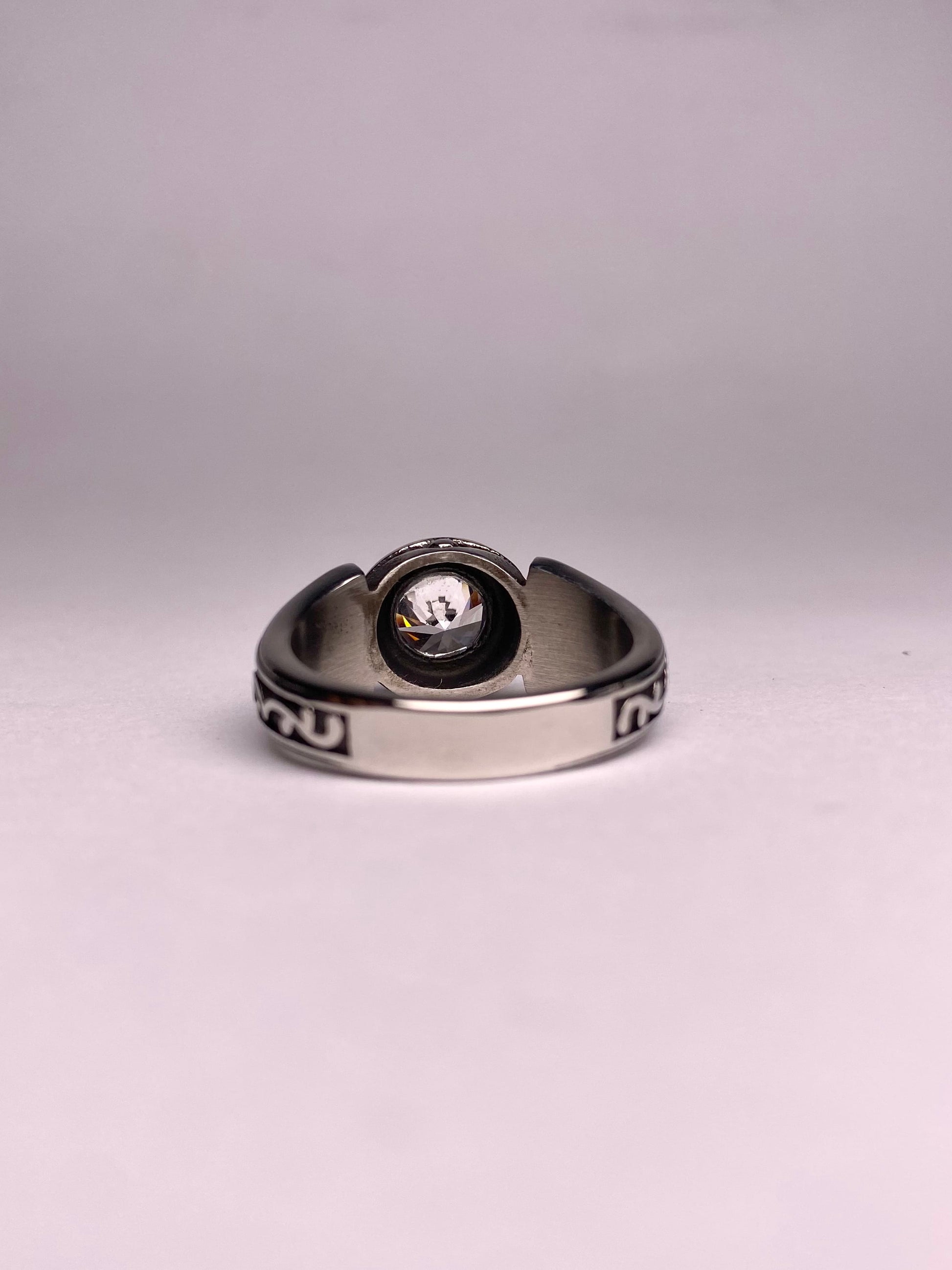 back view of minimal diamond ring for men, polished stainless steel ring with clear round stone, modern and stylish ring available in Pakistan