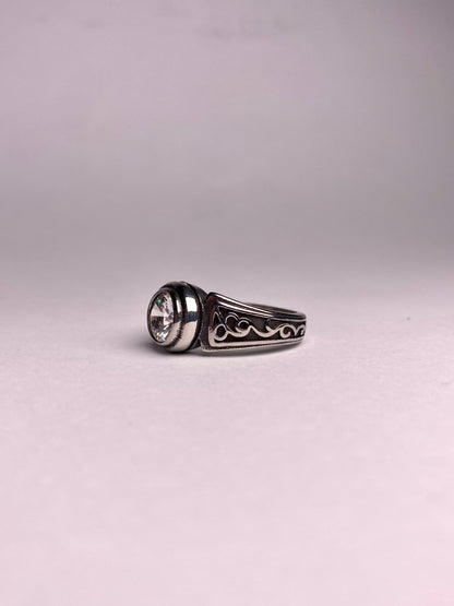Side view of Noor zircon silver ring for men, polished stainless steel ring with clear round stone, modern and stylish ring available in Pakistan
