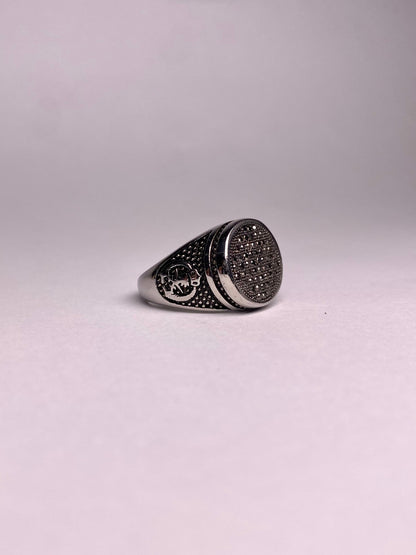 Side view of a Turkish ring showing the detailed crescent moon and star style engravings on a durable, rust-proof stainless steel band.