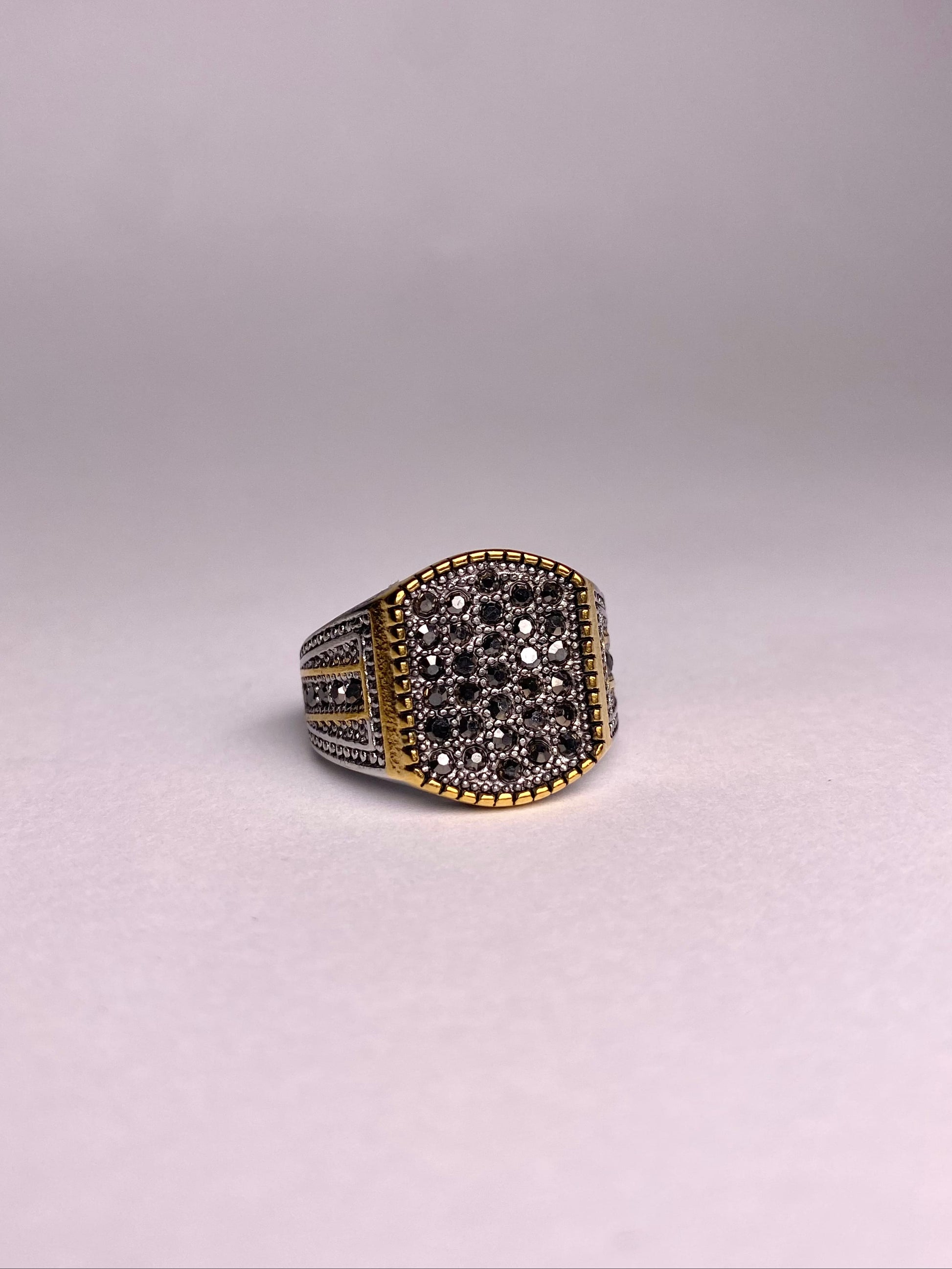 Front view of a premium square-cut black zircon stone set in a gold-plated stainless steel Turkish ring for men.