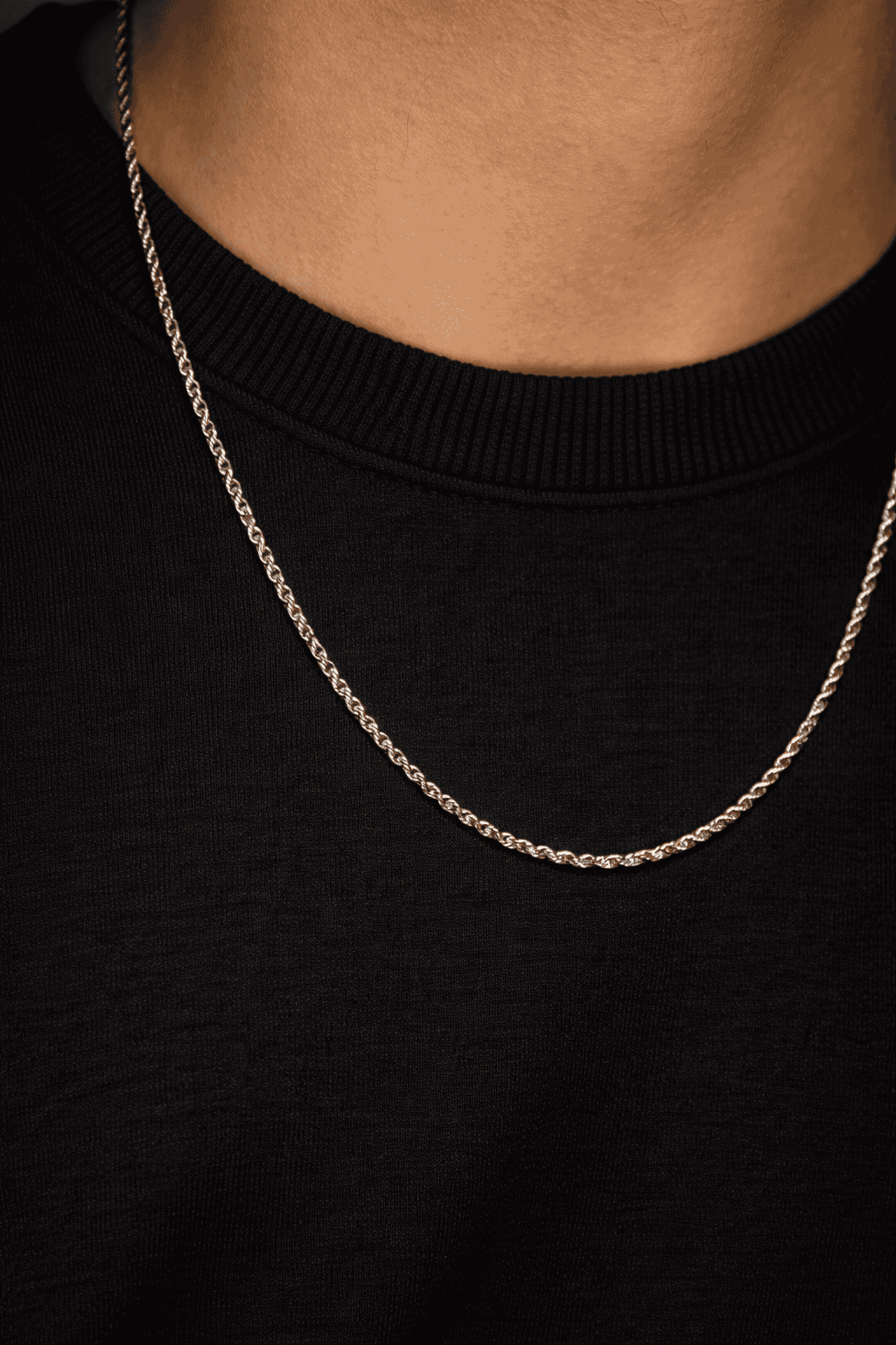 Men stainless steel rope chain necklace in Pakistan, thin polished silver rope link chain worn with black shirt, durable waterproof everyday men jewelry