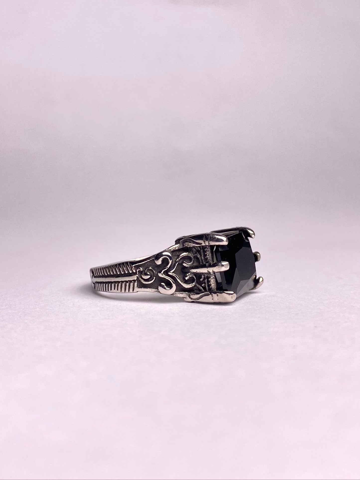 Alt Text: Side view of a premium black agate ring showing the detailed Turkish engraving on the non-tarnish stainless steel band.